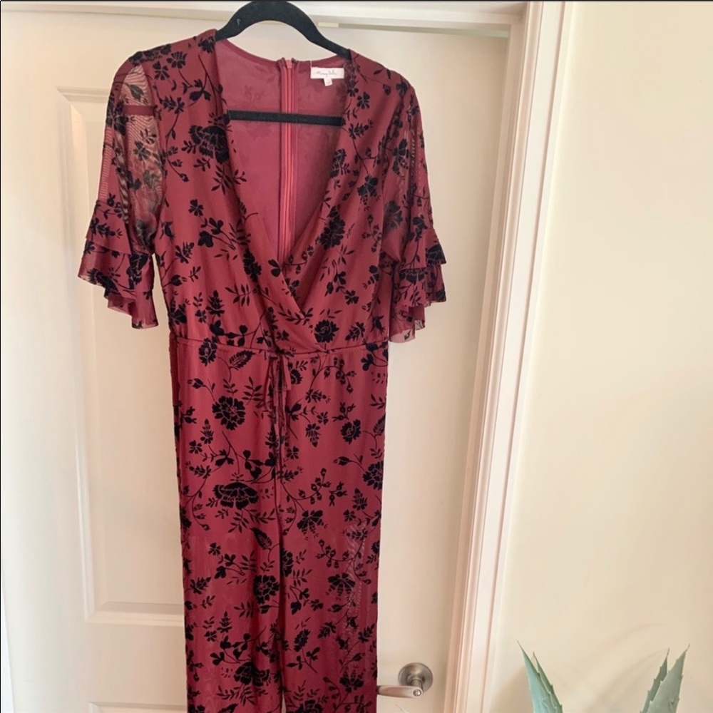 Francesca’s lightweight deep red floral jumpsuit